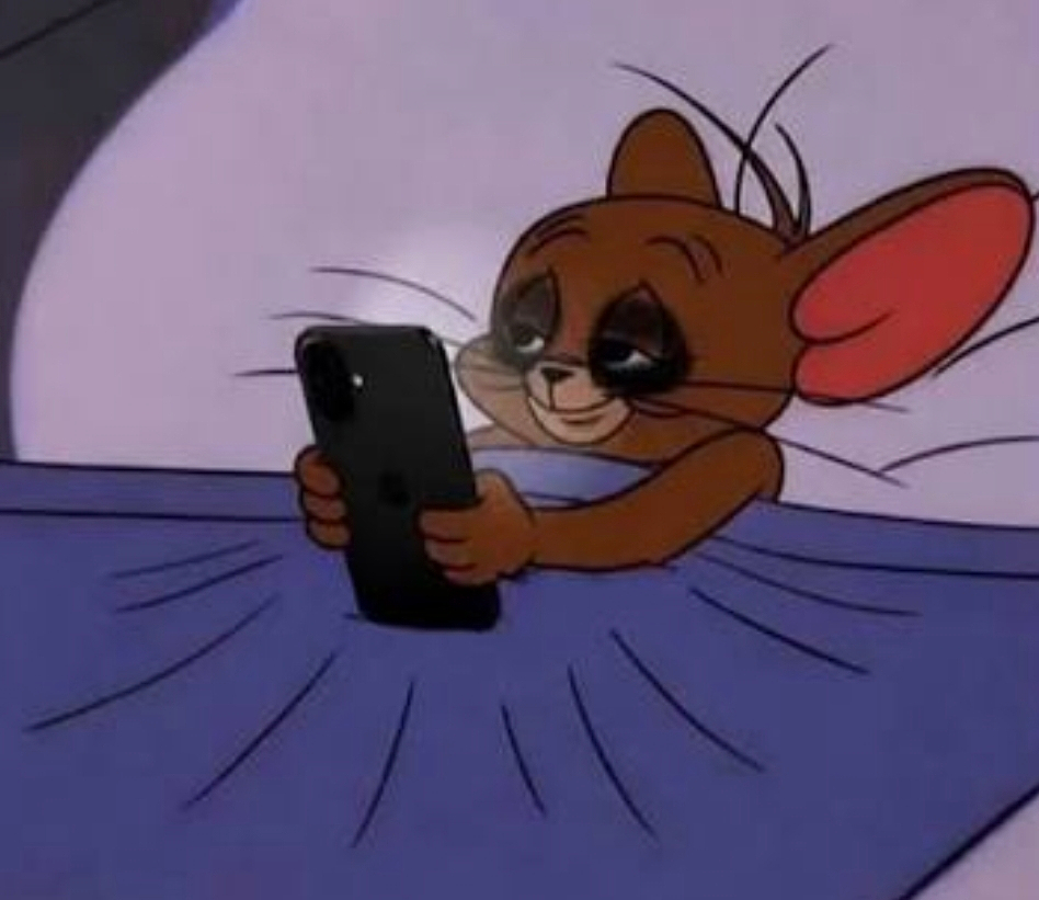 Jerry the mouse is lying in bed with tired eyes, holding a smartphone and smiling.